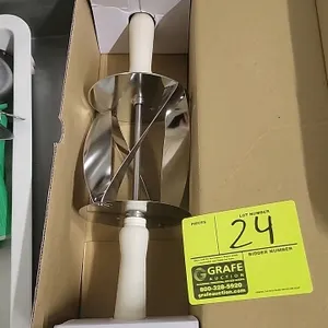 Croissant cutter roller. Features stainless steel blades designed to cut 180mm x 140mm dough triangles. Equipped with dual white plastic handles. Incl