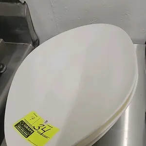 Plastic scale weighing scoop. Features a footed base designed to rest on a scale weighing platform. Constructed of durable white polyethylene.