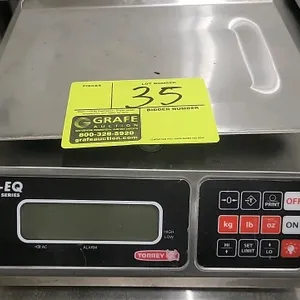 Torrey L-EQ Series digital portion control scale. Features stainless steel construction, a digital display, and a sealed keypad with weighing units in