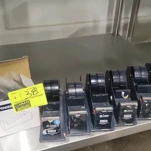 Uline H-440 industrial metal tape dispenser. Features heavy-duty steel construction, dual-roll capability, and a weighted slip-resistant base. Designe