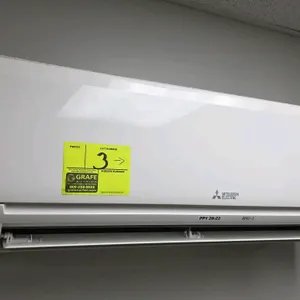 Mitsubishi Electric split-system heat pump. Includes MSZ-GL12NA wall-mounted indoor unit (S/N: 11E32590) and MUZ-GL12NA outdoor condenser unit (S/N: 1