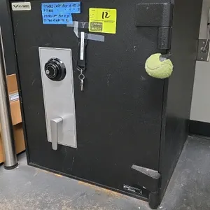 AMSEC single-door dial safe. Features a Sargent & Greenleaf dial combination lock. Combination and keys are included. Dimensions: 26" x 26" x 30".