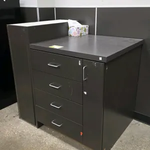 Laminated cabinet. Features dark brown laminate finish, (4) drawers with metal pull handles, (1) narrow side storage compartment with hinged door, and