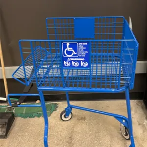 Blue coated wire wheelchair-attachable shopping cart. Designed to couple with a wheelchair. Features a blue powder-coated wire basket with handicap ac