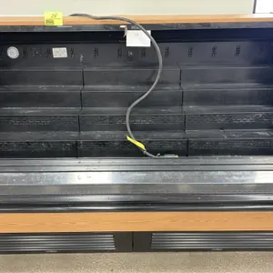 2021 Southern CaseArts LMRM-HA-06.0 self-contained refrigerated berry merchandiser. Features tiered black shelving, wood grain laminate exterior, and 