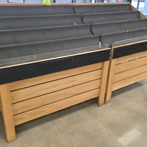 Wood produce display. Features wooden slat frame construction, four-tiered black molded display shelves, and a clear plastic front guard with a front 