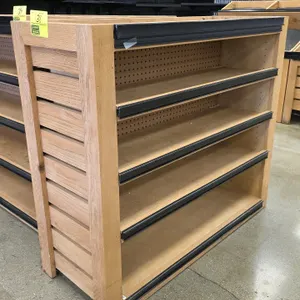 Bradley wood produce display shelving unit. Features a wood frame with slat end panels, perforated pegboard backing, 4 shelves with price tag channels