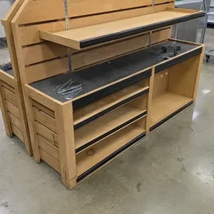 Bradley wood produce displays. Features wood construction with slatwall backing, adjustable wood upper shelves, and black-matted display decks. Includ