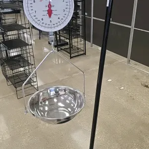 Detecto MCS-20W hanging dial produce scale. Features a 20 lb capacity with 1 oz graduations. Includes a stainless steel produce pan suspended by a met