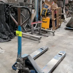 2007 Evolution manual pallet jack. Features a blue steel frame, loop handle with three-position control lever, and polyurethane wheels. S/N: 07013085-