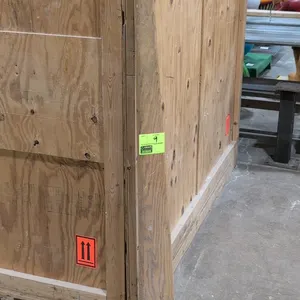 Wood lever dolly. Features a heavy-duty hardwood handle stenciled with "C72 IW", a green steel nose plate, and dual iron wheels. 6'L. Background crate