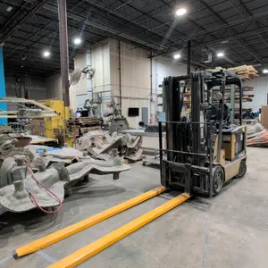 Caterpillar E5000 electric forklift. Features a 3-stage mast with a 188" max fork height and a 4,450 lbs capacity at a 24" load center. Equipped with 