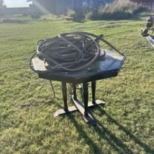 small wooden table and long torch hoses