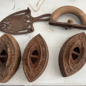 Set of antique cast iron sad irons and handle