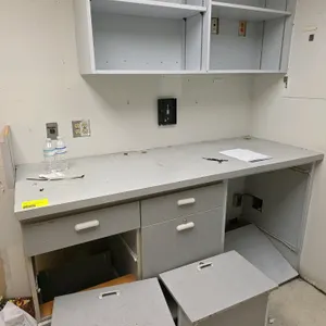 Right to office fixtures in room includes 78" / 151" Upper and lower laminate wood cabinets and counters, cork boards and more