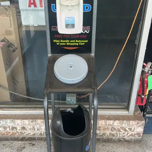 Metal hand sanitizer and cart wiping station. Features a top-mounted Triple S FoamClean hand sanitizer dispenser, an integrated center wipe dispenser 
