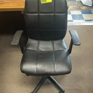 Rollable office task chair. Features black vinyl upholstery with grid-stitched padding on the seat and backrest. Equipped with fixed black plastic arm