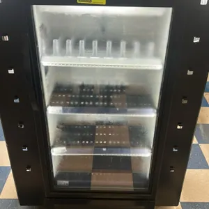 True GDM-10SSL-HC-TSL01 self-contained single glass door beverage cooler. Features black exterior with surround pegboard display frame, LED interior l
