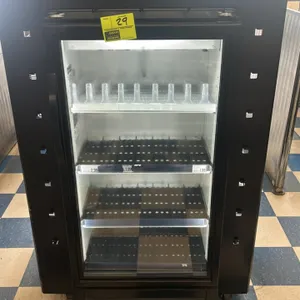 True GDM-10SSL-HC~TSL01 glass door merchandiser. Features self-contained refrigeration, LED lighting, black exterior, and integrated side and top disp
