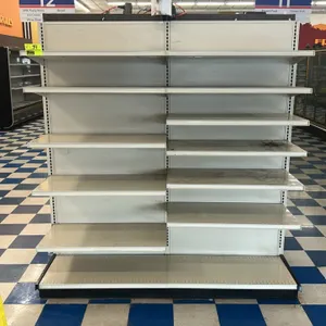 6'L of Lozier wall shelving. Features 19"D base shelves and adjustable upper shelves. Single-sided wall configuration. Stands 77"H. Note: Contents, co
