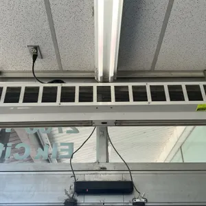 Dayton 4YP02B compact air curtain. Features a white metal housing and a 1/8 HP motor. S/N: 0510190444. Electrical: 120V, 1-Phase, 60Hz, 1.9 Amps. Ceil