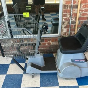 Carts and Parts, Inc. Handy Helper Electric Shopper motorized shopping cart. Features front wire basket, black molded plastic seat, and T-bar steering