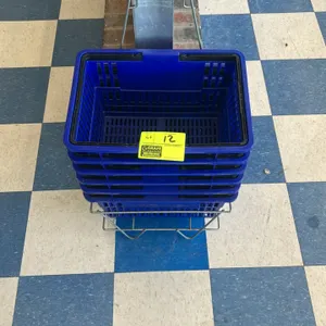Poly shopping basket. Features blue plastic construction and dual folding black handles. 17"L. Includes metal wire floor stand.
