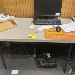 Poly folding table. Features a light gray polyethylene tabletop and gray folding metal legs. Dimensions: 4'L x 2'W. Note: Computer, electronics, and a