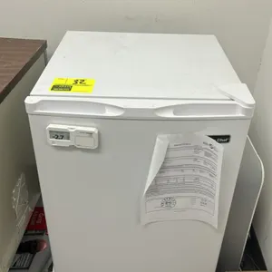 2020 Magic Chef MCUF3W2 self-contained mini household upright freezer. Features a white finish, single door, and two wire shelves. Equipped with a doo