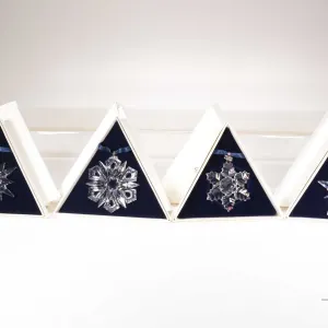 Four Swarovski Crystal collectible snowflakes 1996, 1997, 1999 and 2001