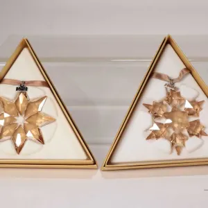 Four Swarovski Crystal collectible snowflakes including 3 X Swarovski SCS including two 2010 and one