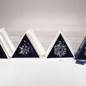 Four Swarovski Crystal collectible snowflakes including 2 X 2000, 1999 and 2006
