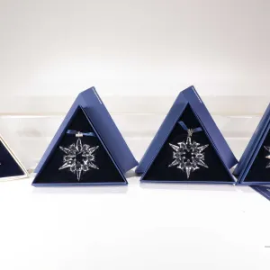 Four Swarovski Crystal collectible snowflakes including 1996, 2006, 2007 and 2011 20th anniversary