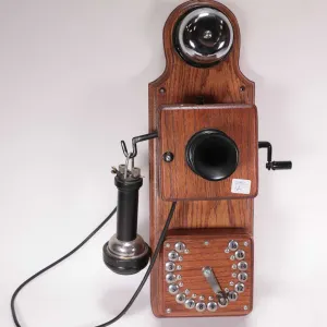 Vintage wood-cased Strowger Automatic electric telephone circa 1910 features numbers up to 16