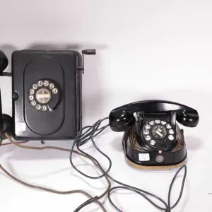 2 Vintage phones including a vintage FTR Kettle Bell Bakelite phone model RTT 56, and a Western Elec