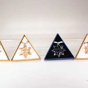 Four Swarovski Crystal collectible snowflakes including 2007, 2008, 20 Year 2011 and an SCS 2011