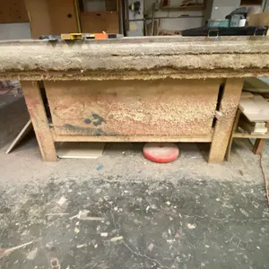 WOODEN SHOP TABLE WITH ASSORTED WOOD PIECES APPROX 97"L X 50"D X 39"H *CONTENTS ON TOP OF TABLE NOT