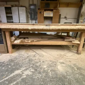 WOODEN SHOP TABLE WITH ASSORTED WOOD PIECES APPROX 122"L X 62"D X 35"H
