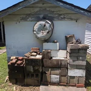 Cinder block, galvanized tub, etc behind old