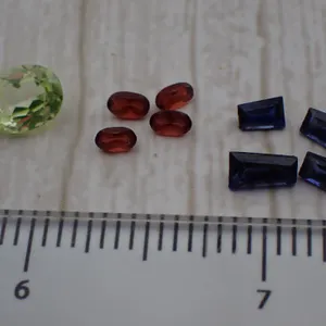 Loose Gemstone Parcel of 9 - Tapered Baguette Blue, Oval Red & Green Stone Lot