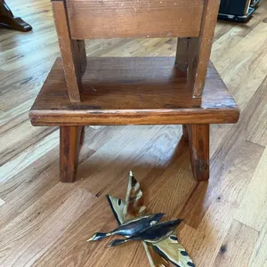2 primitive stools , metal geese
