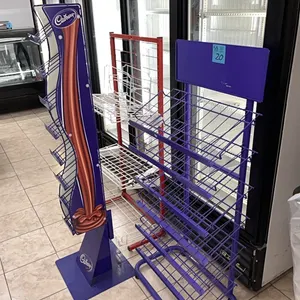 3 display racks, red is 54” tall and 25” wide, purple is 54” tall and 25” wide, cadbury is 61” tall