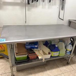 Stainless Steel Table, 5’ x 2’6” x 2’10” tall, on wheels