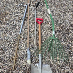 Assorted hand tools- rake, shovel