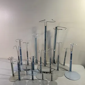 19 Porcelain doll display stands