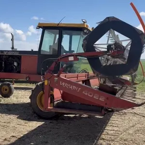 Versatile 4700 self-propelled 23 1/2' swather, U2 pickup reel, door window glass is shattered, canvasses poor condition, see lot details and VIDEO