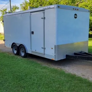 Wells Cargo enclosed trailer, 8.5' x 16', rear barn doors, 36" entry door, 5000 lb torsion axles, ladder racks, lined interior, front cabinets, was us