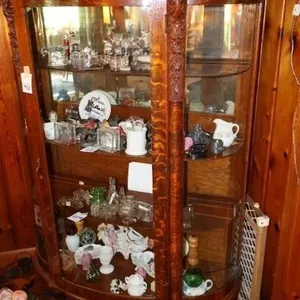Antique bow front claw foot China cabinet