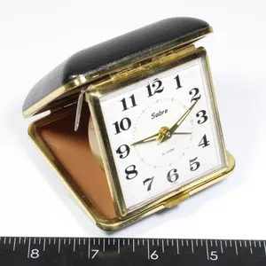 VINTAGE SABRE BRAND TRAVEL ALARM CLOCK IN A FOLD