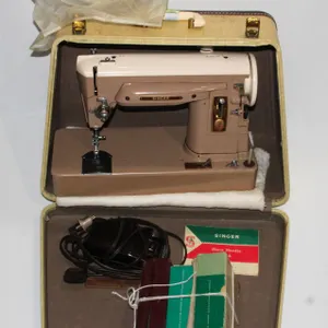 SINGER SEWING MACHINE WITH ATTACHMENTS